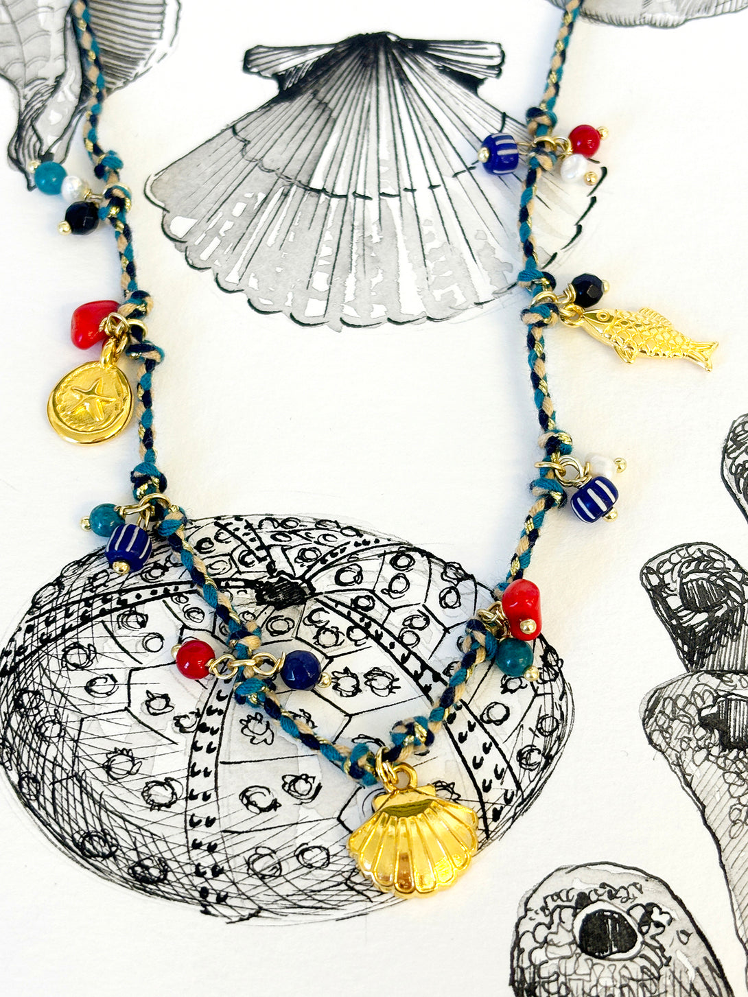 Blue Thread Necklace with Coral and Shell Charm | Queen Magpie.